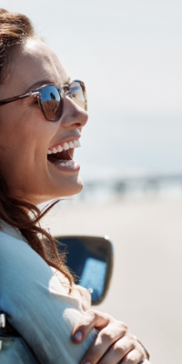 Woman happy in a car